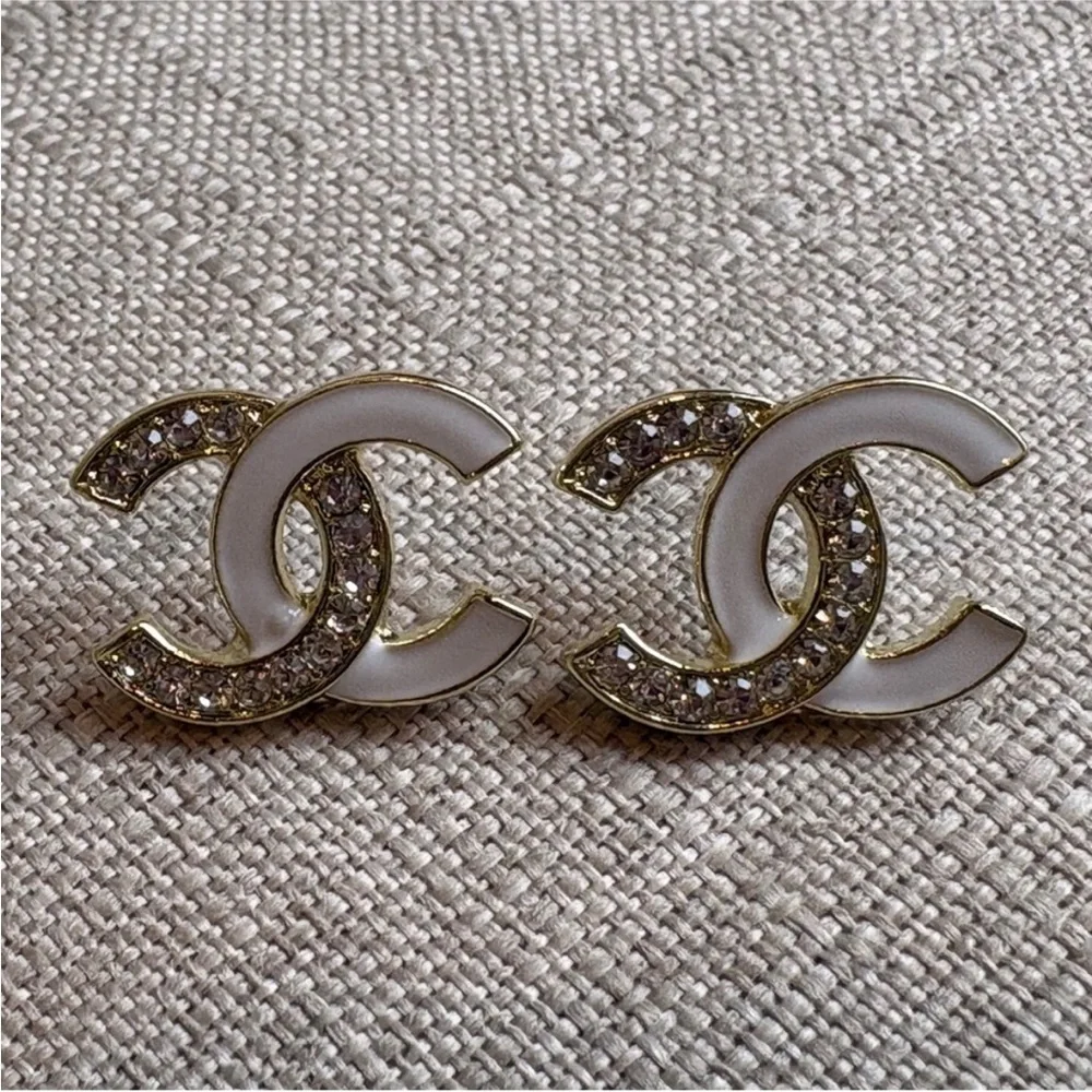 CHANEL White Enamel and Gold Logo Crystal Stud Earrings